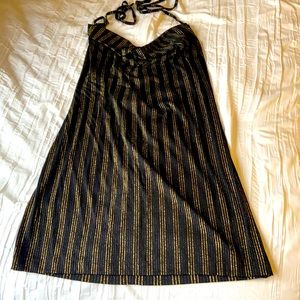 Roushed neckline and low back gold and striped black dress